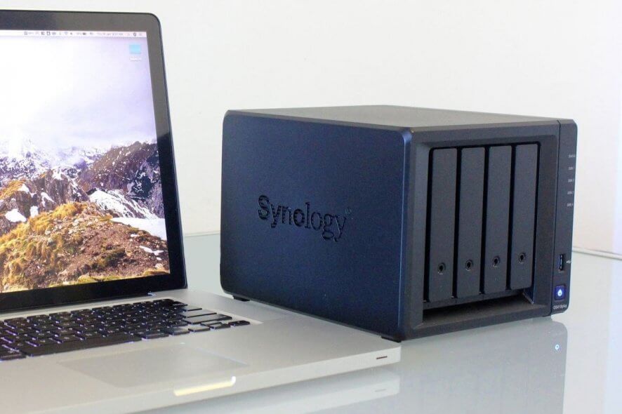 NAS drive for media streaming - NAS drive on desk with laptop